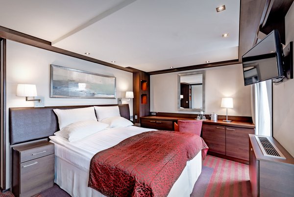 Inside view of the cabins in category E on the A-ROSA CLEA with french balcony.