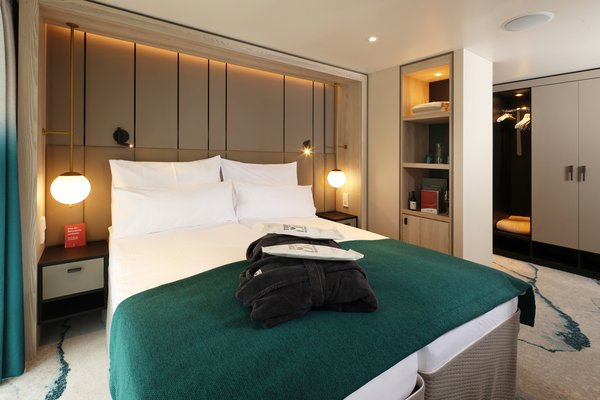 Inside view of the cabins in category F on the A-ROSA SENA with balcony.